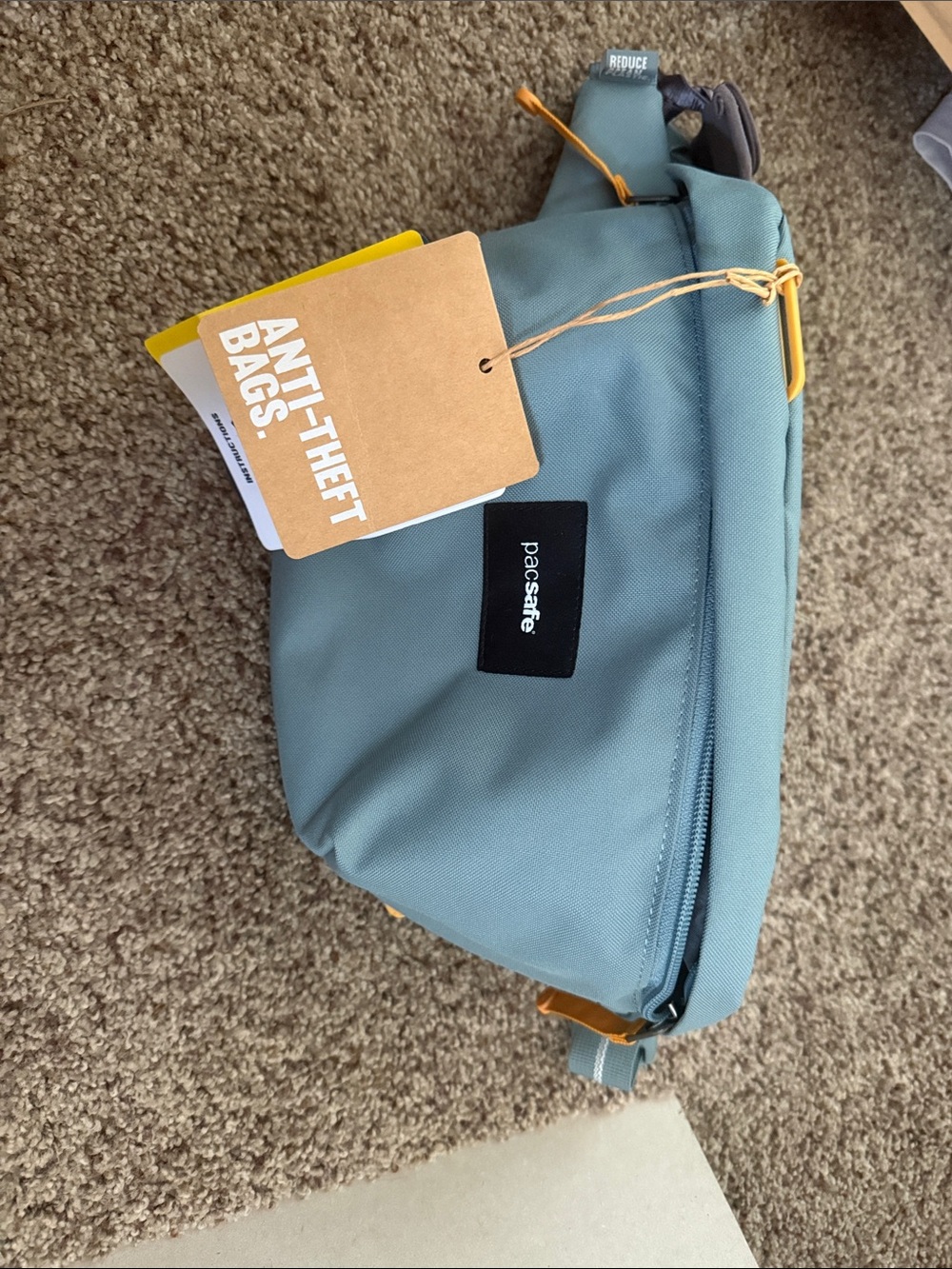 Pacsafe Teal Blue Anti-Theft Crossbody Bag with Yellow Accents